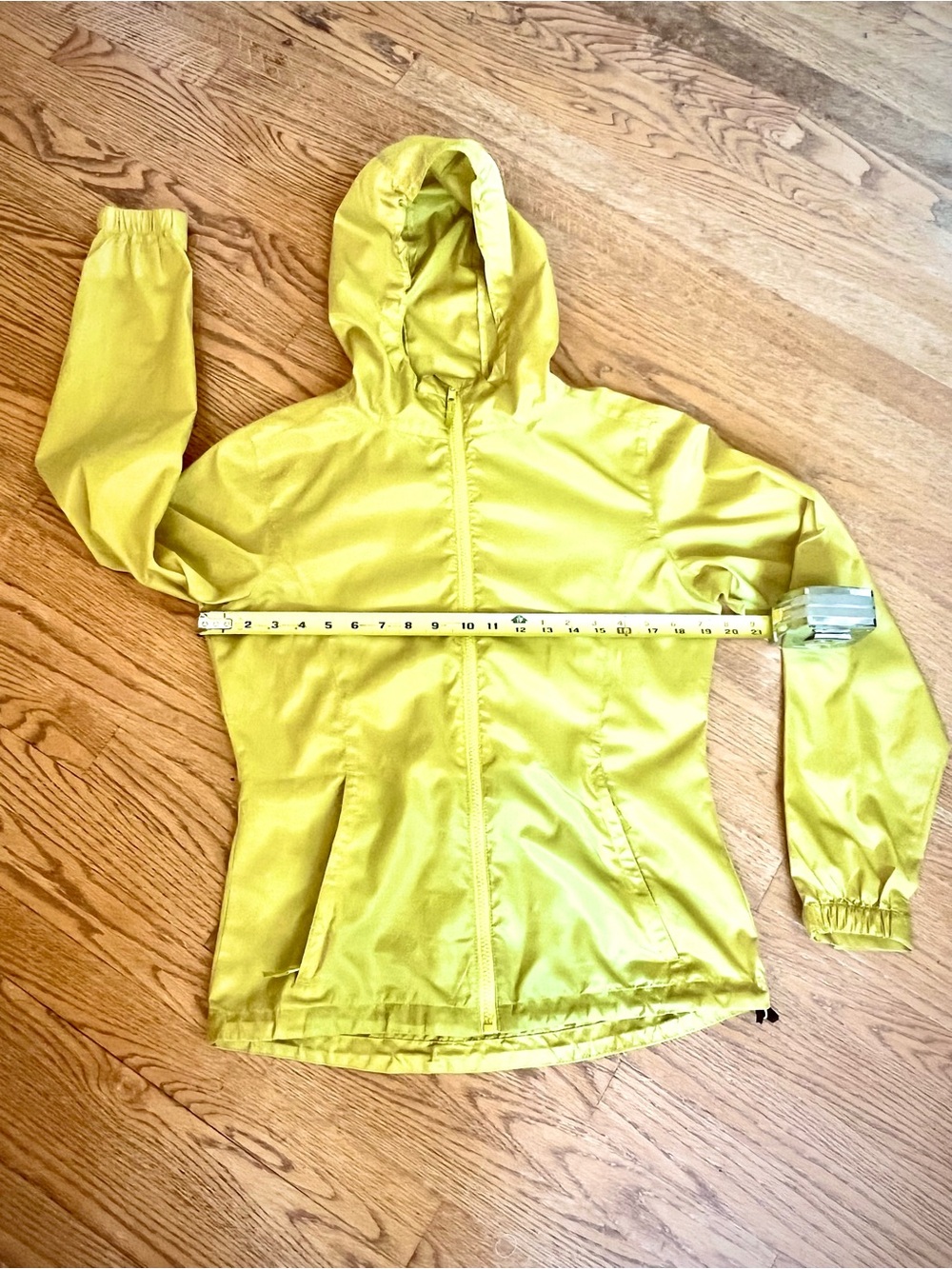 Women’s Sierra Designs lime-colored lightweight hooded/zippered jacket.